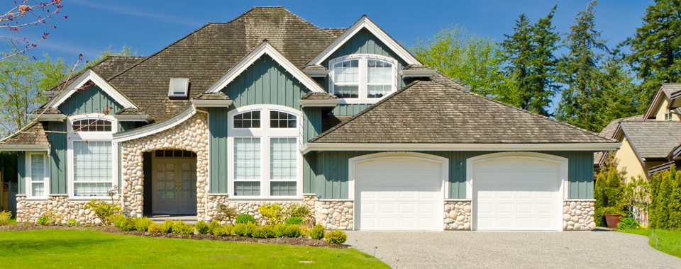 a luxury two car garage door house